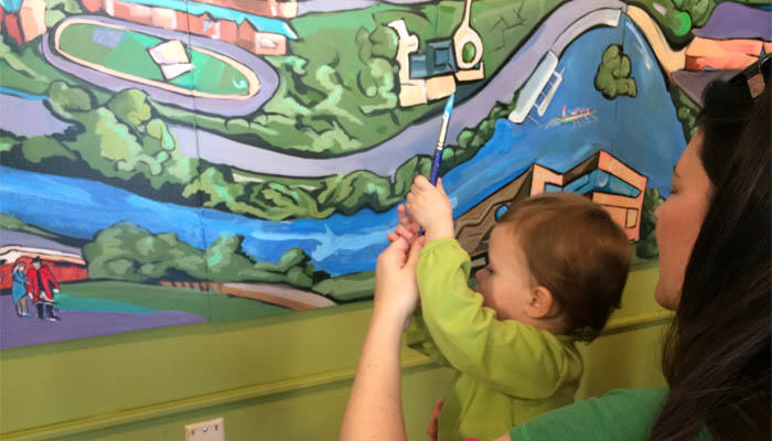 child painting mural