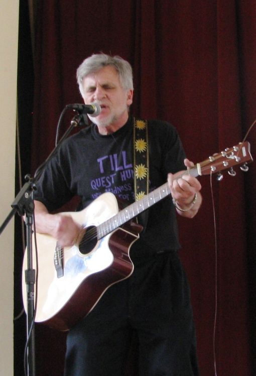 John Stevens Cult Fest, playing a guitar and singing