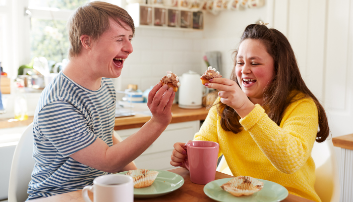 young adults enjoying cupcakes