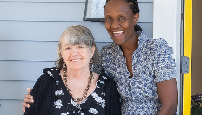 Two women on porch of group home