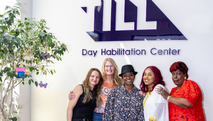 Happy group of staff members at Day program