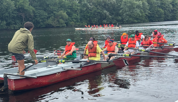 A group of individuals rowing