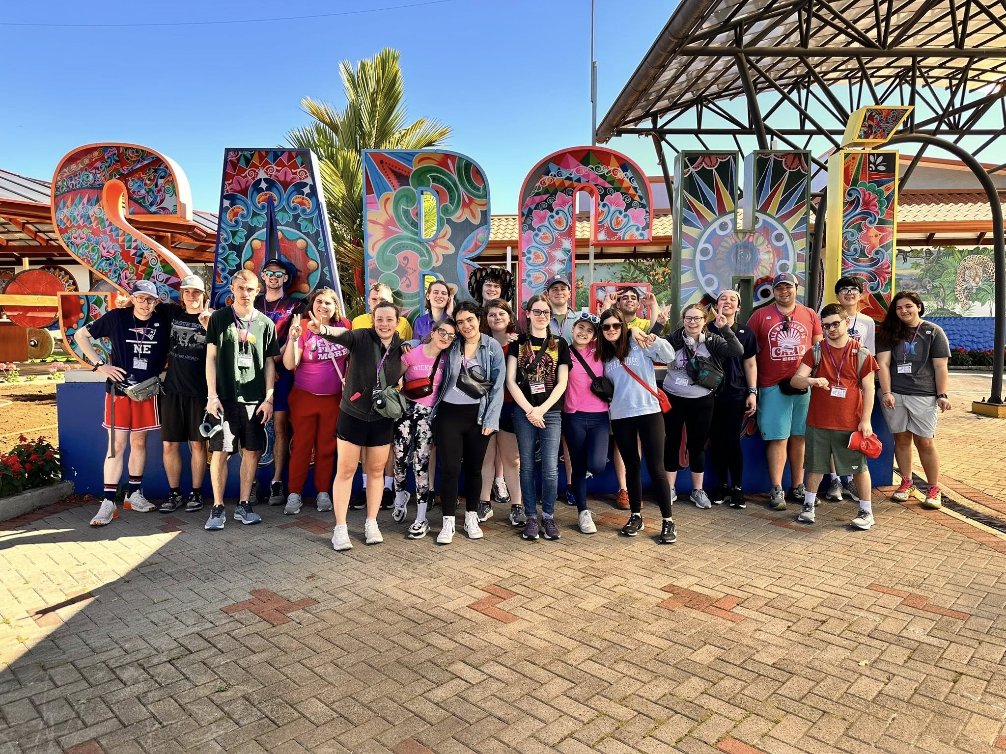 Group photo of RiverView Students in front of large sign 