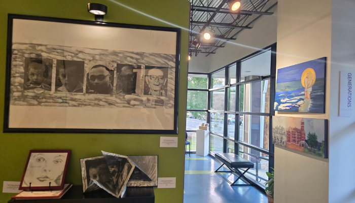 Art gallery with multiple pieces of art displayed.