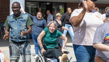 Woman in wheelchair at outdoor celebration