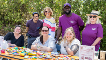 Staff members collect kindness rocks