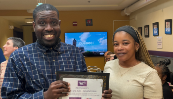 Two people holding award