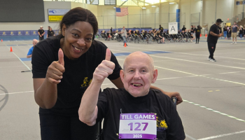 A women and a individual with their thumbs up 