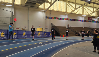 Individuals lined up at the track