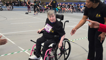 Individual smiling in wheelchair