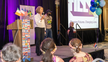 Dafna on stage speaking to the crowd