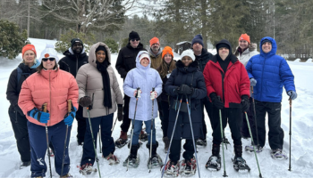 Group photo in snow while snowshoeing