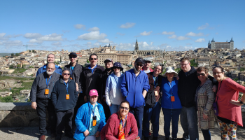 Spain 2022 group photo with city is the background