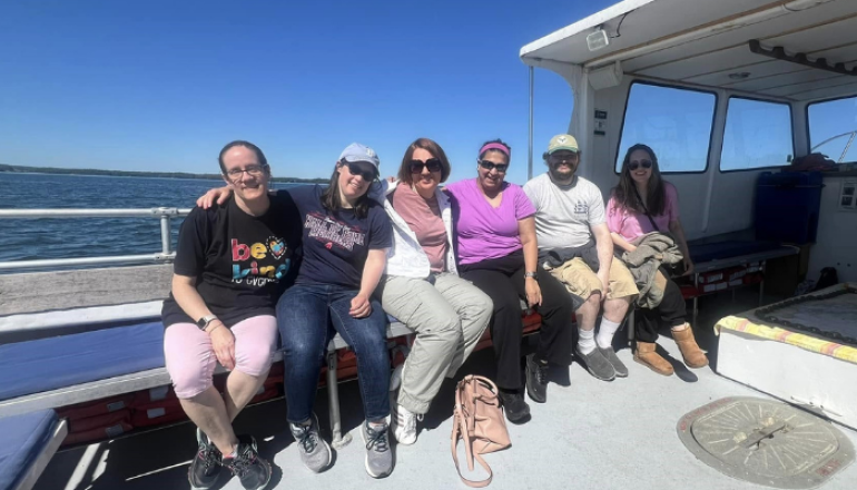 Group of young adults on boat cruise