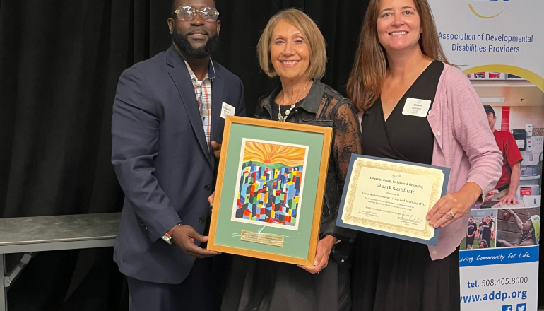 Dafna, Kingsley, and Allison holding up ADDP Award