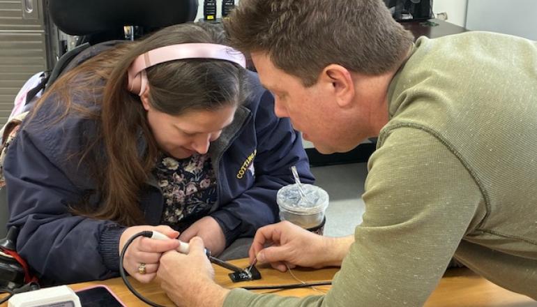 Caleb teaching a individual at TCB 
